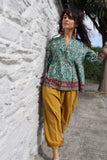 Turquoise border print blouse