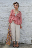 Pom pom detail tiered peach blouse