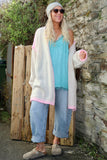 Pink whipstitch and cream cardigan