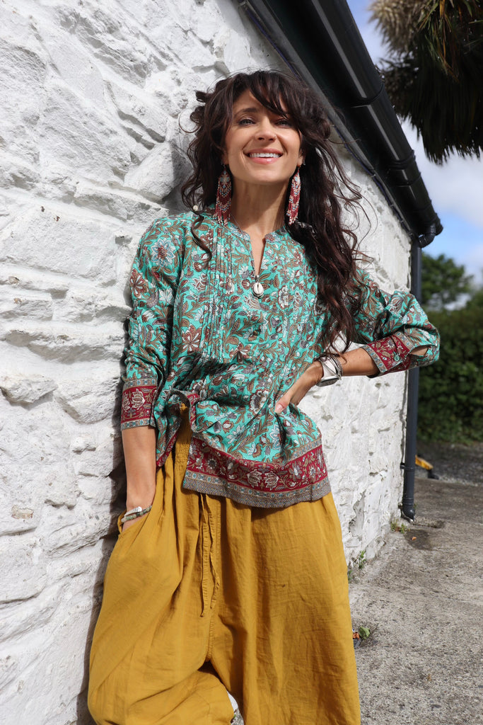 Turquoise border print blouse