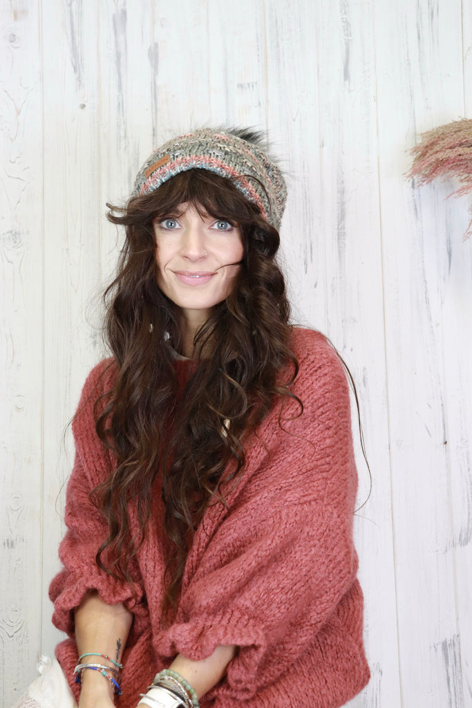 Speckle knit pom pom beanie