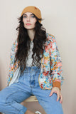 Floral bomber jacket with rust trim