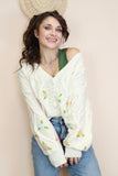 Cream cardigan with embroidered flowers